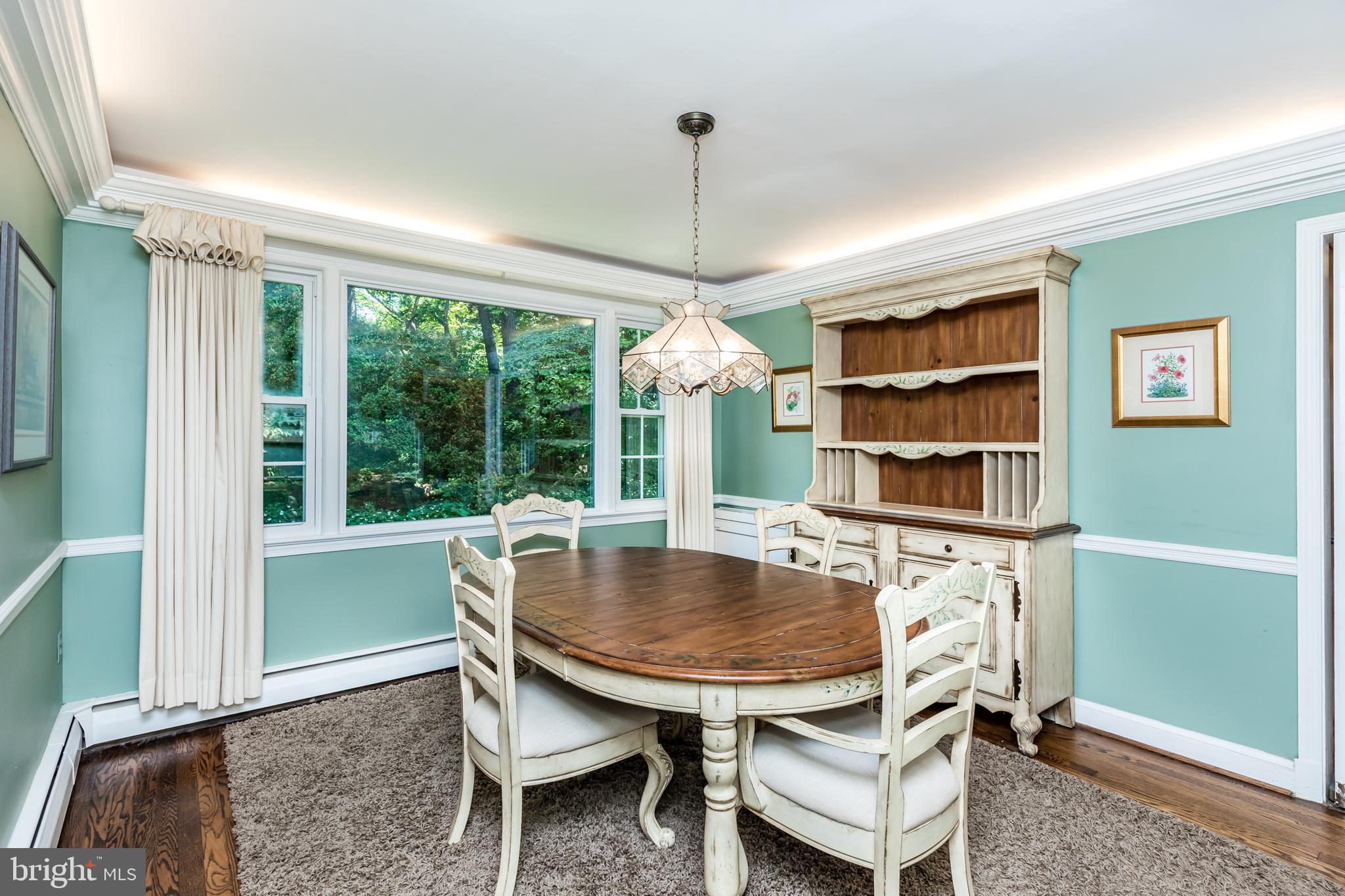6901 Dorsey Road Laytonsville, MD 20882 - Photo 14 of 60 Formal dining with hardwood flooring & uplighting