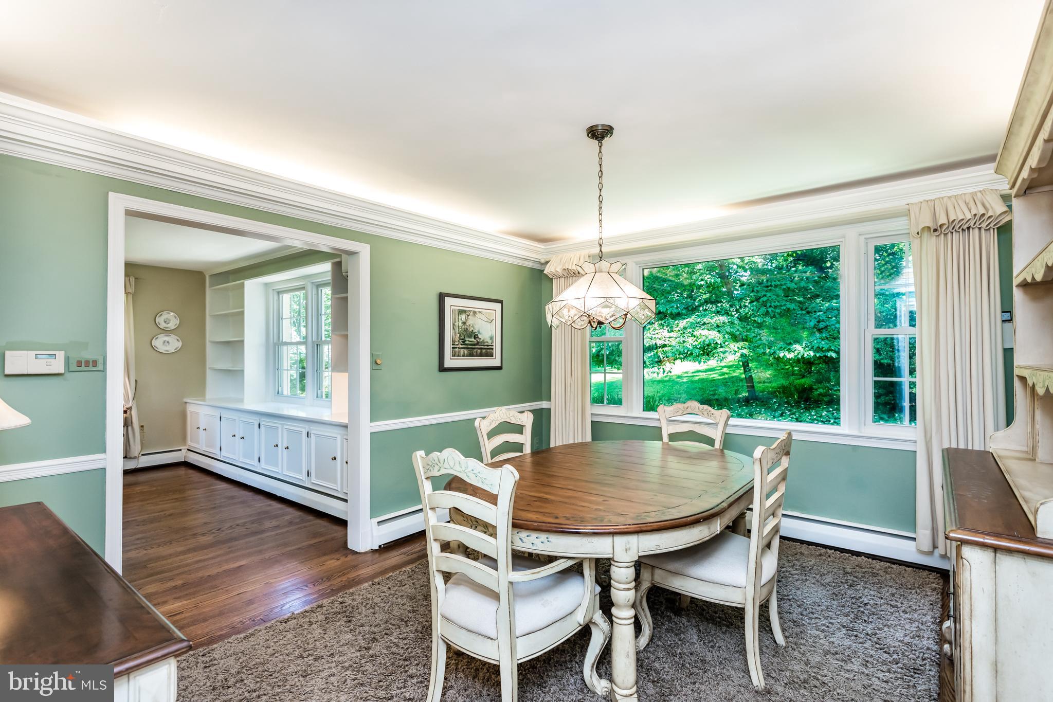 6901 Dorsey Road Laytonsville, MD 20882 - Photo 15 of 60 Formal dining with hardwood flooring & uplighting