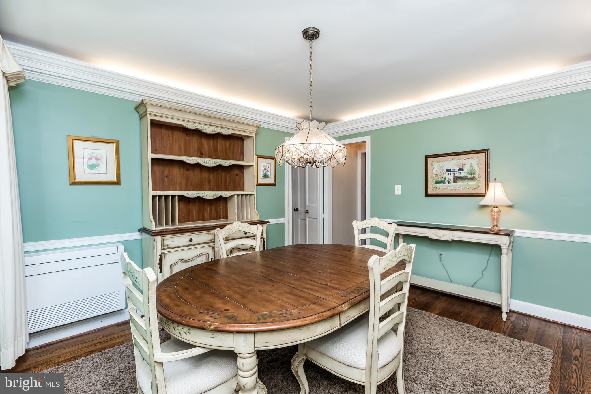 6901 Dorsey Road Laytonsville, MD 20882 - Photo 16 of 60 Formal dining with hardwood flooring & uplighting