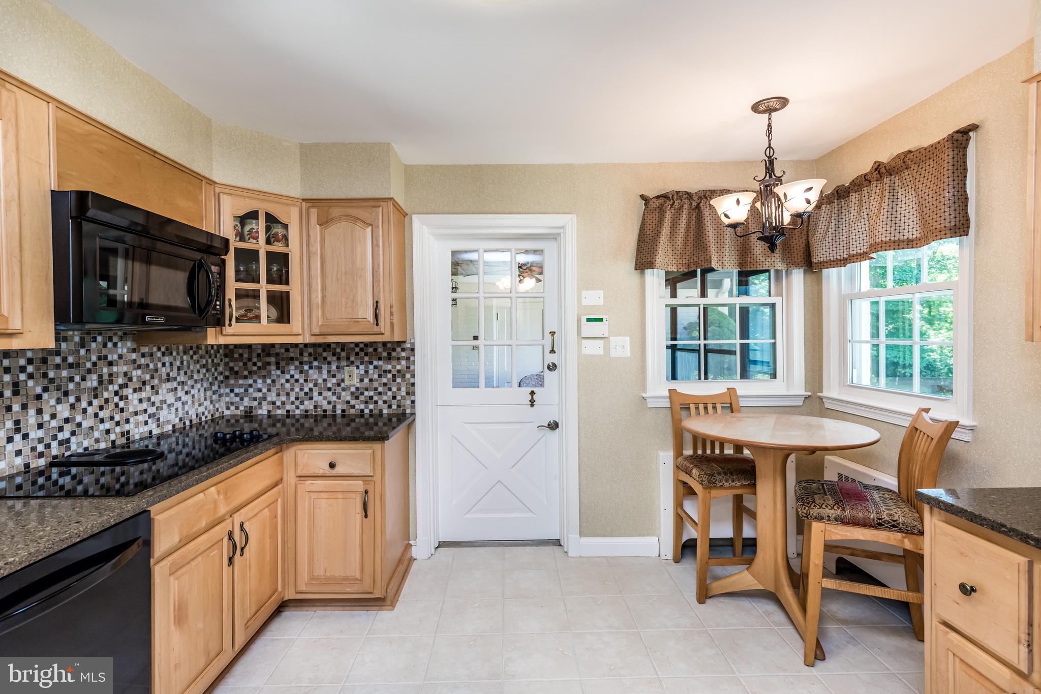 6901 Dorsey Road Laytonsville, MD 20882 - Photo 20 of 60 Kitchen with tile backsplash, & granite counters