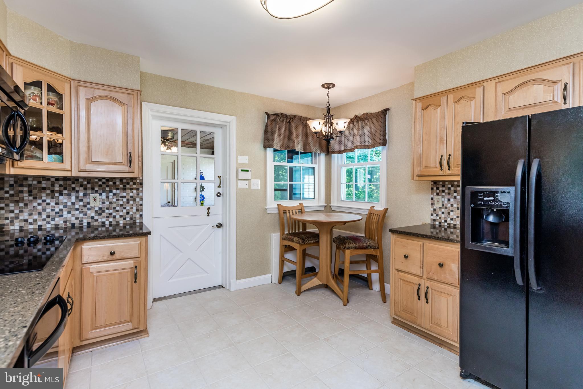 6901 Dorsey Road Laytonsville, MD 20882 - Photo 21 of 60 Kitchen with tile backsplash, & granite counters