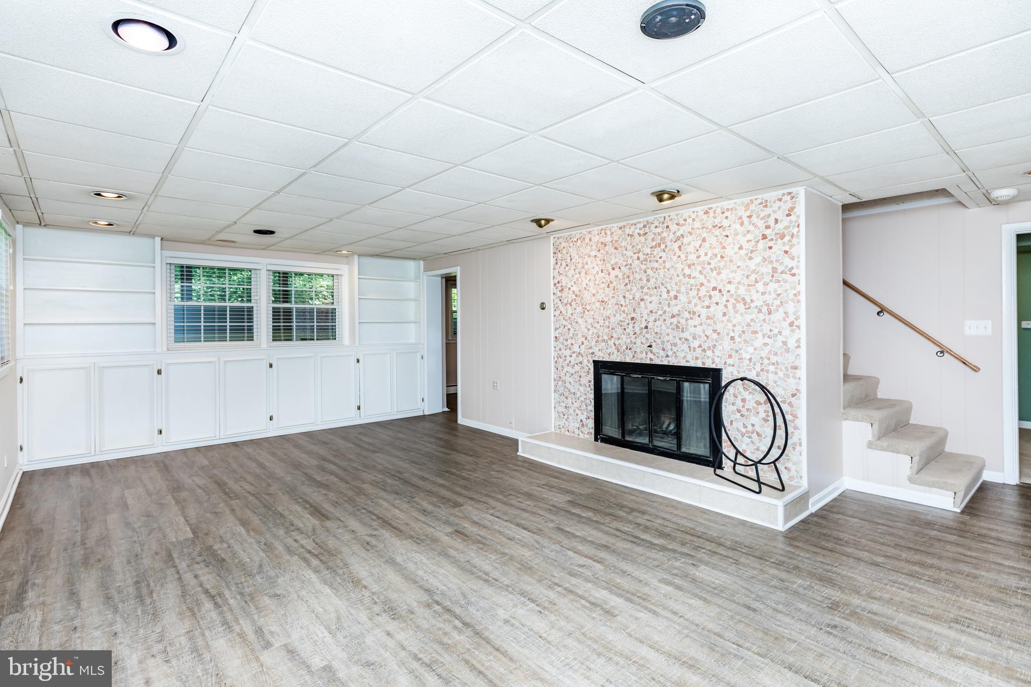 6901 Dorsey Road Laytonsville, MD 20882 - Photo 36 of 60 Basement rec room w/fireplace & built ins