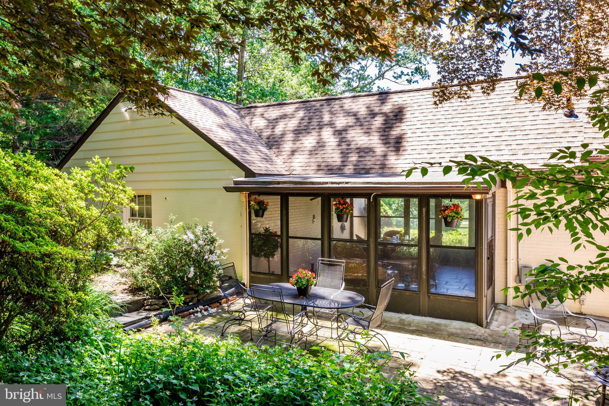 6901 Dorsey Road Laytonsville, MD 20882 - Photo 52 of 60 Rear brick patio with lush landscaping