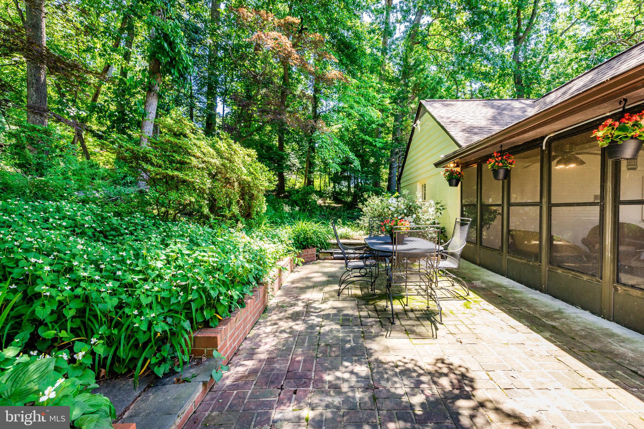 6901 Dorsey Road Laytonsville, MD 20882 - Photo 53 of 60 Rear brick patio with lush landscaping