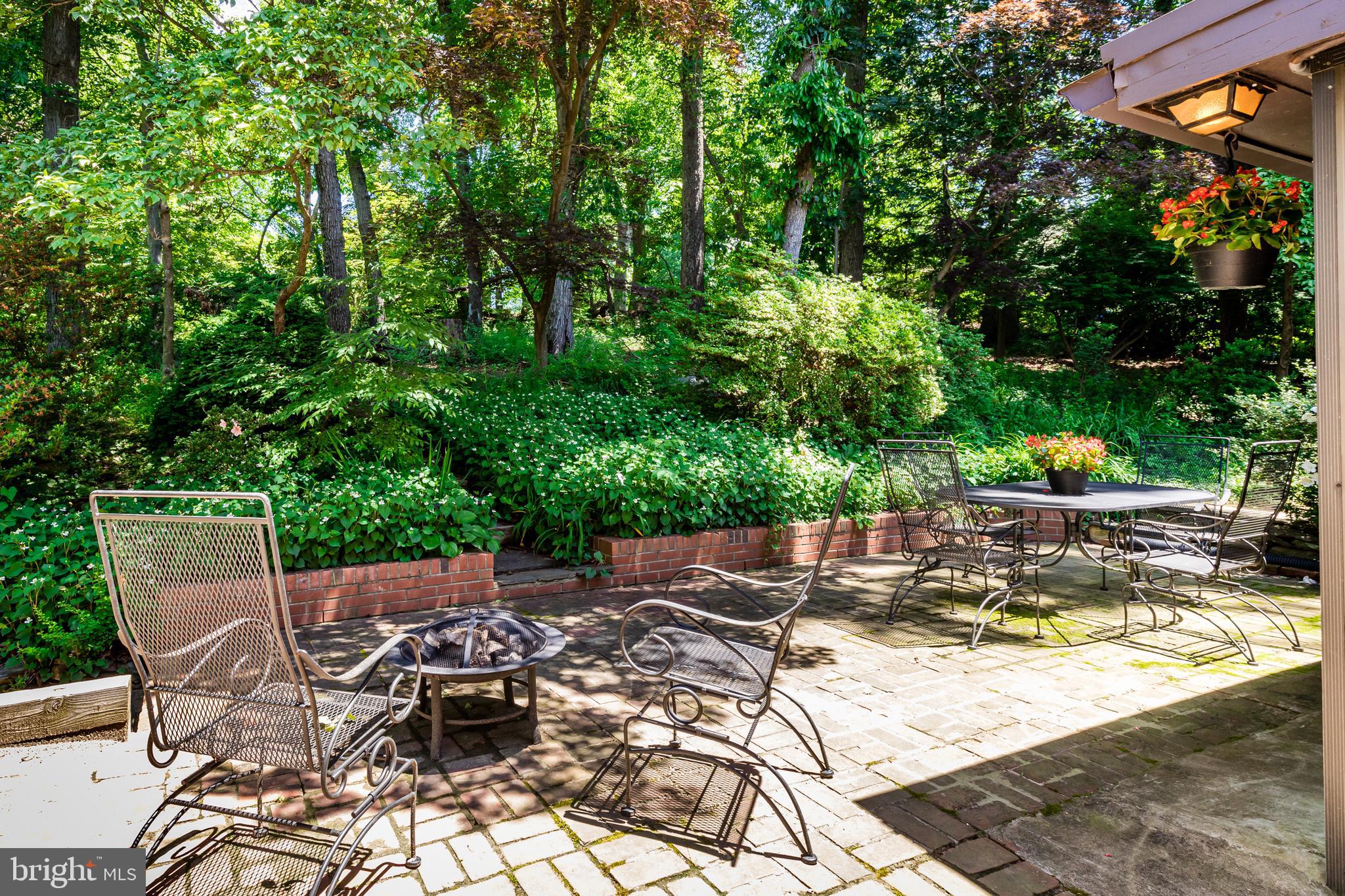 6901 Dorsey Road Laytonsville, MD 20882 - Photo 55 of 60 Rear brick patio with lush landscaping
