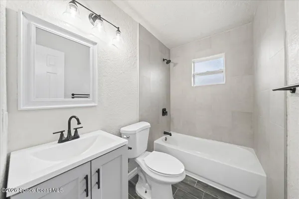 a bathroom with a sink toilet and a bathtub