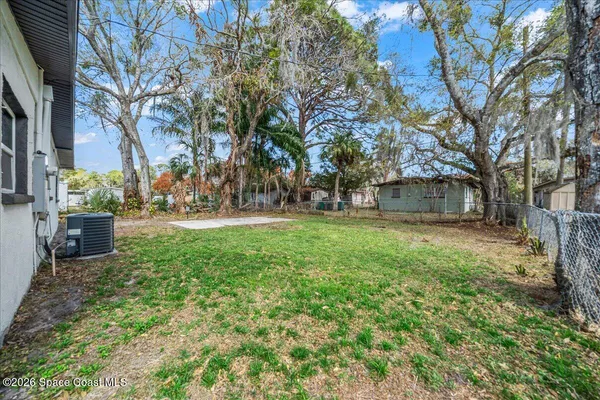 a view of outdoor space with deck and tree