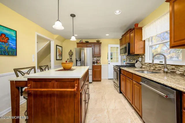 a view of a livingroom with furniture and wall clock
