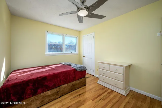 a view of yard with swimming pool and green space