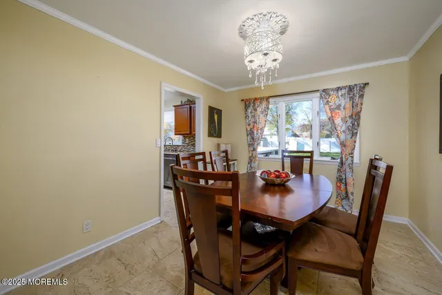 a kitchen with stainless steel appliances granite countertop a stove refrigerator sink and microwave