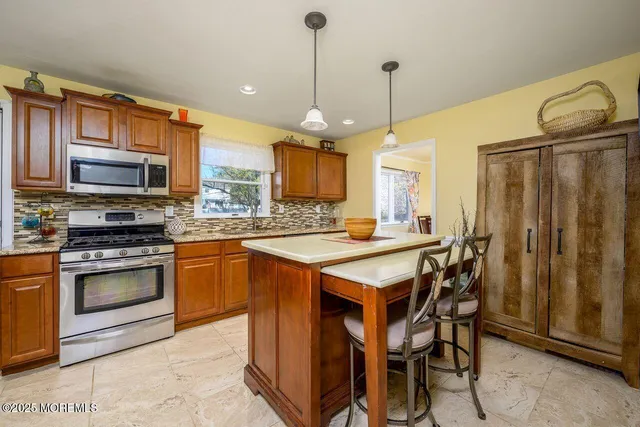 a kitchen with a sink and a refrigerator