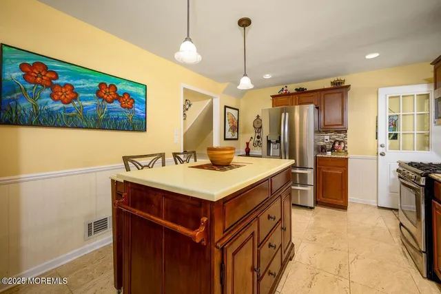 a kitchen with granite countertop a sink and a stove