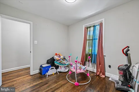 a room with furniture and wooden floor