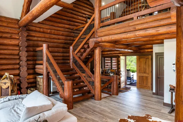 a view of an entryway with wooden floor