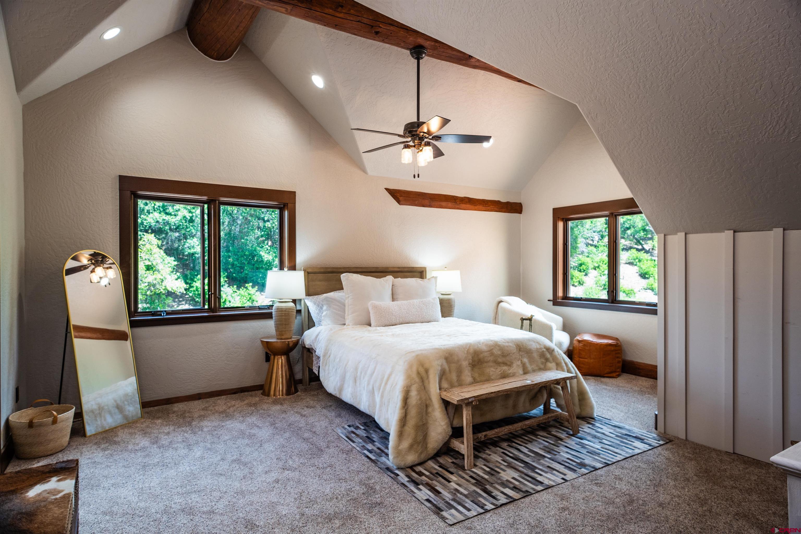 6590 Road 46 Mancos, CO 81328 - Photo 20 of 35 a bedroom with a bed and a window
