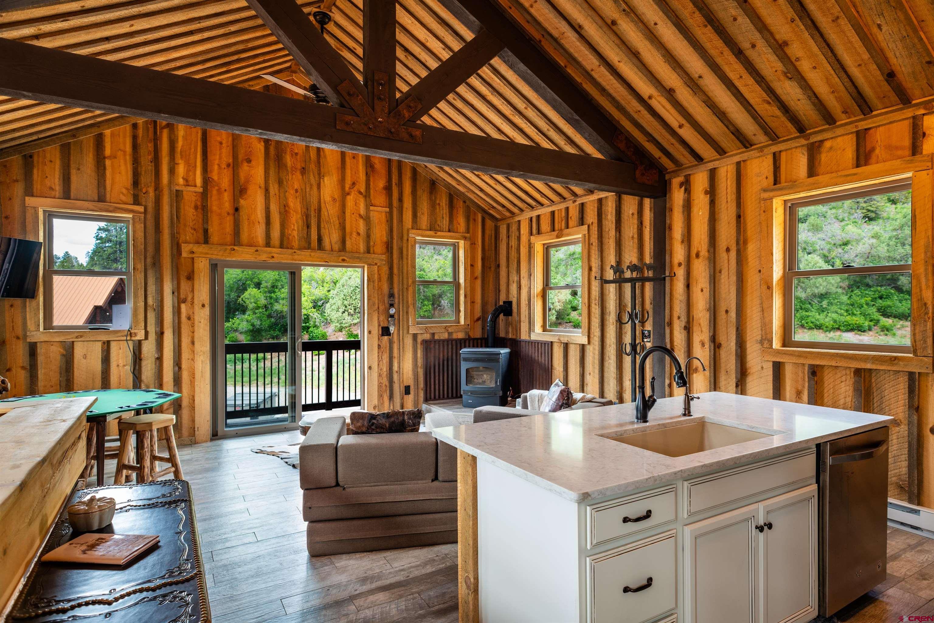 6590 Road 46 Mancos, CO 81328 - Photo 27 of 35 a kitchen with a sink and large windows