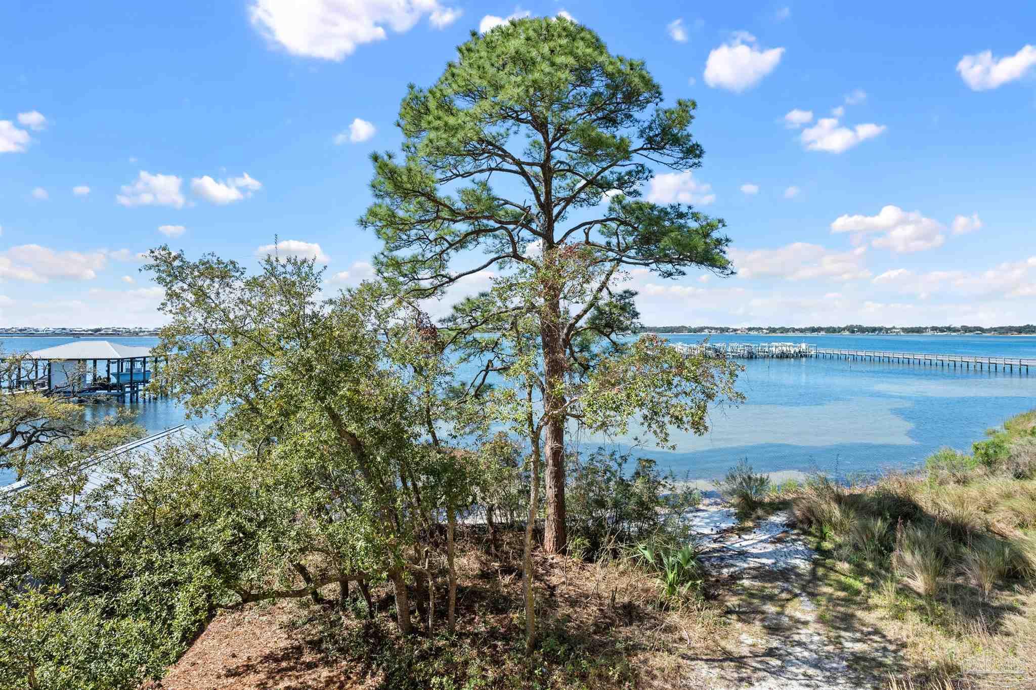 14500 River Road, Unit 101 Pensacola, FL 32507 - Photo 13 of 61 a view of a lake with a building in the background