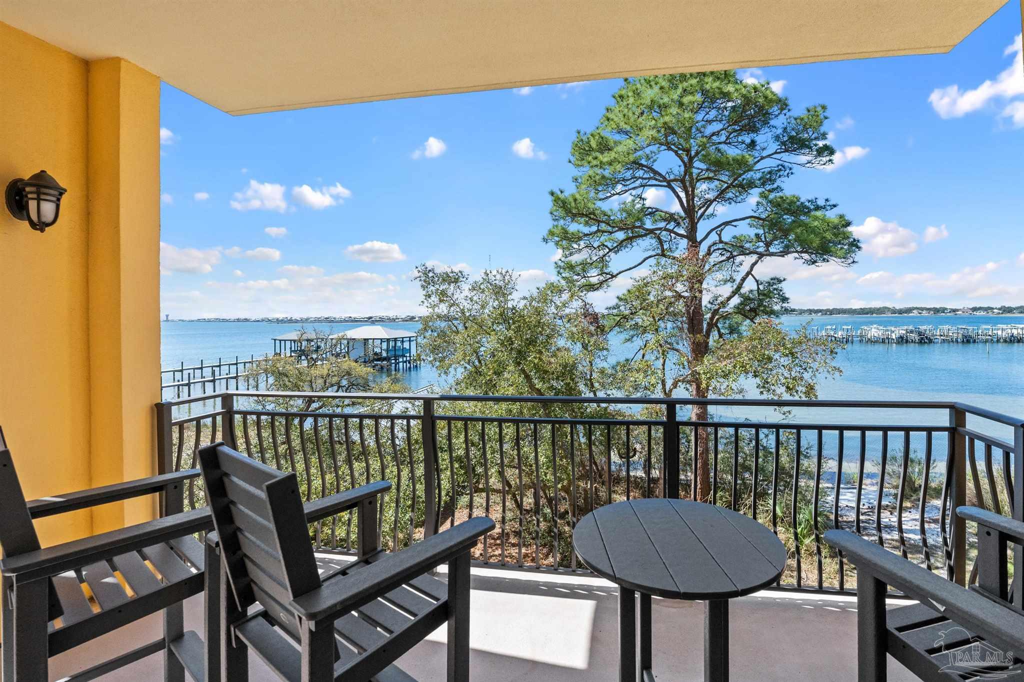 14500 River Road, Unit 101 Pensacola, FL 32507 - Photo 14 of 61 a view of a city from a balcony with furniture