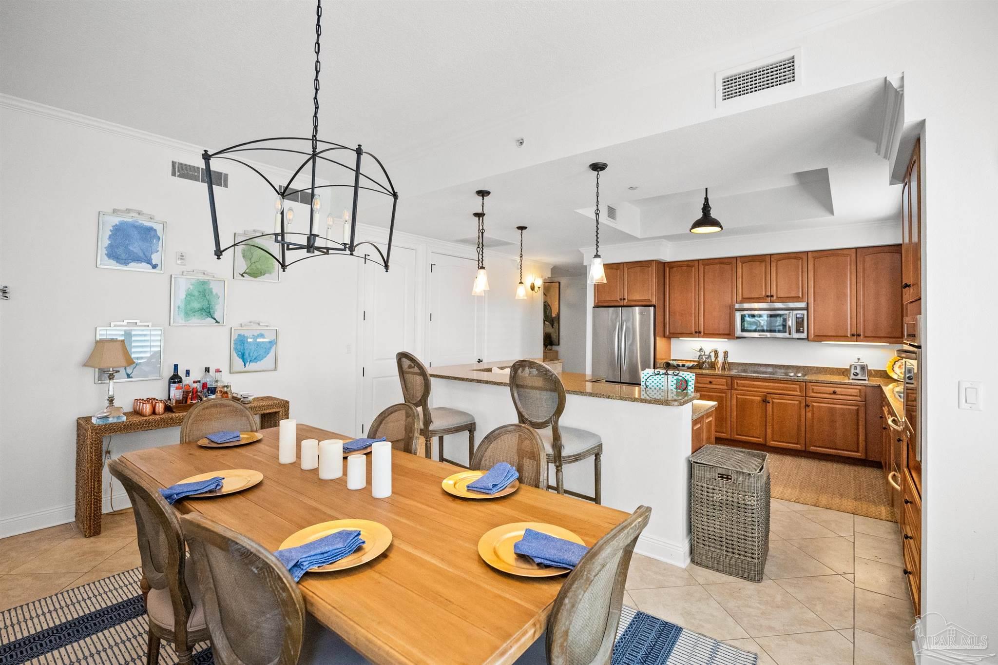 14500 River Road, Unit 101 Pensacola, FL 32507 - Photo 21 of 61 a view of a dining room with furniture