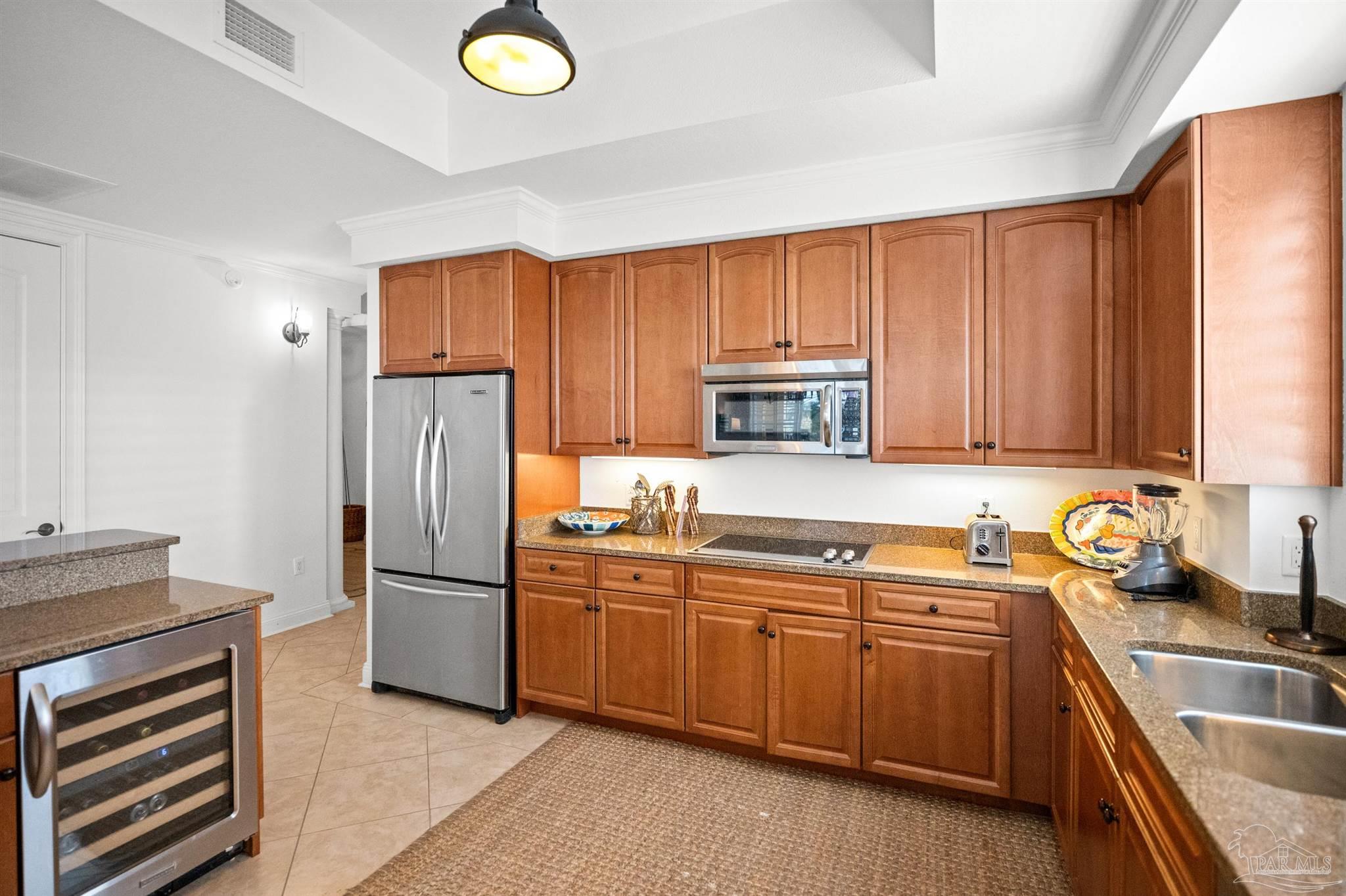 14500 River Road, Unit 101 Pensacola, FL 32507 - Photo 23 of 61 a kitchen with a sink appliances and cabinets