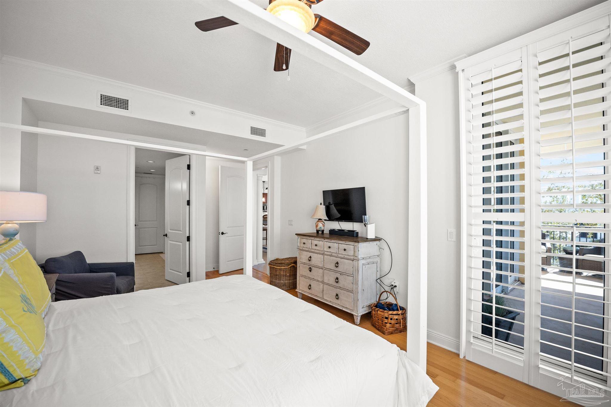 14500 River Road, Unit 101 Pensacola, FL 32507 - Photo 31 of 61 a bedroom with a bed and a flat screen tv