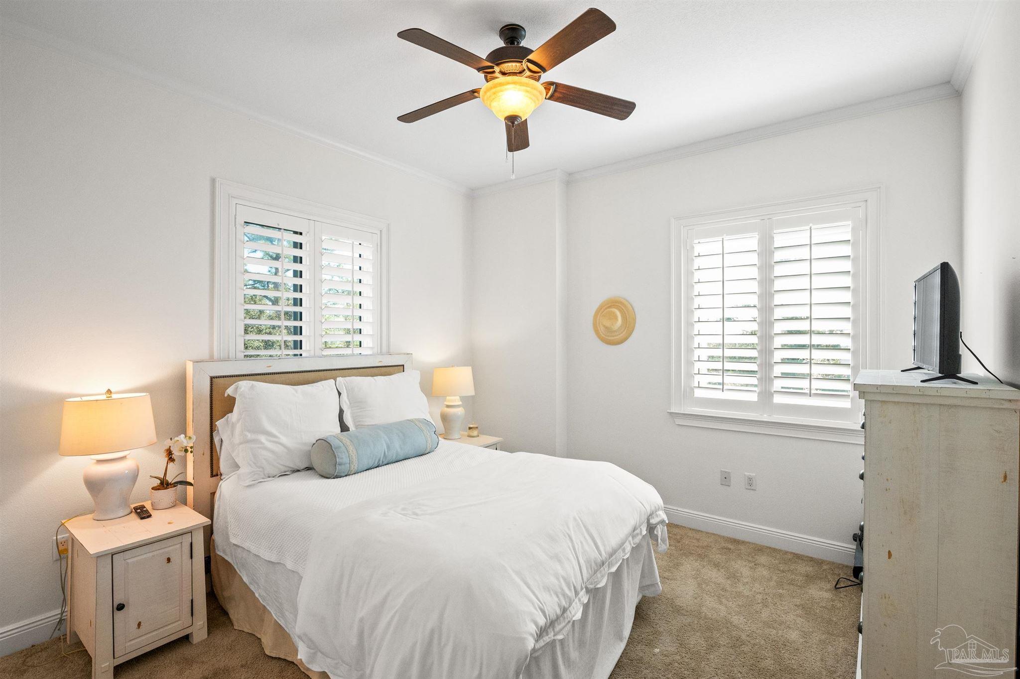 14500 River Road, Unit 101 Pensacola, FL 32507 - Photo 46 of 61 a bedroom with a bed and a window