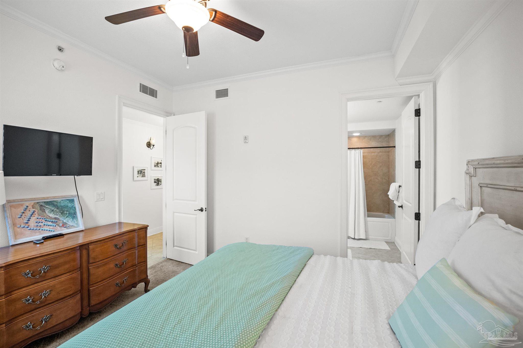 14500 River Road, Unit 101 Pensacola, FL 32507 - Photo 48 of 61 a bedroom with a bed and a dresser