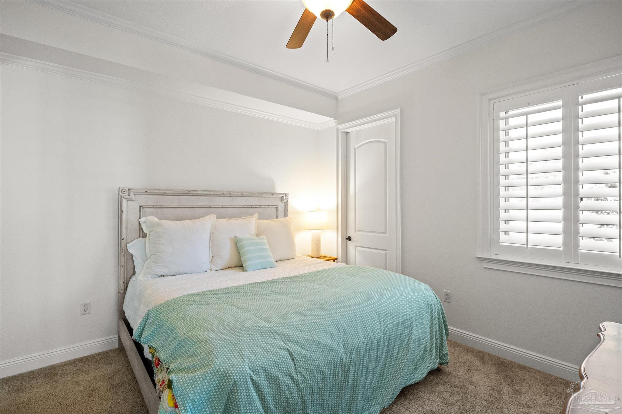 14500 River Road, Unit 101 Pensacola, FL 32507 - Photo 49 of 61 a bedroom with a bed and window