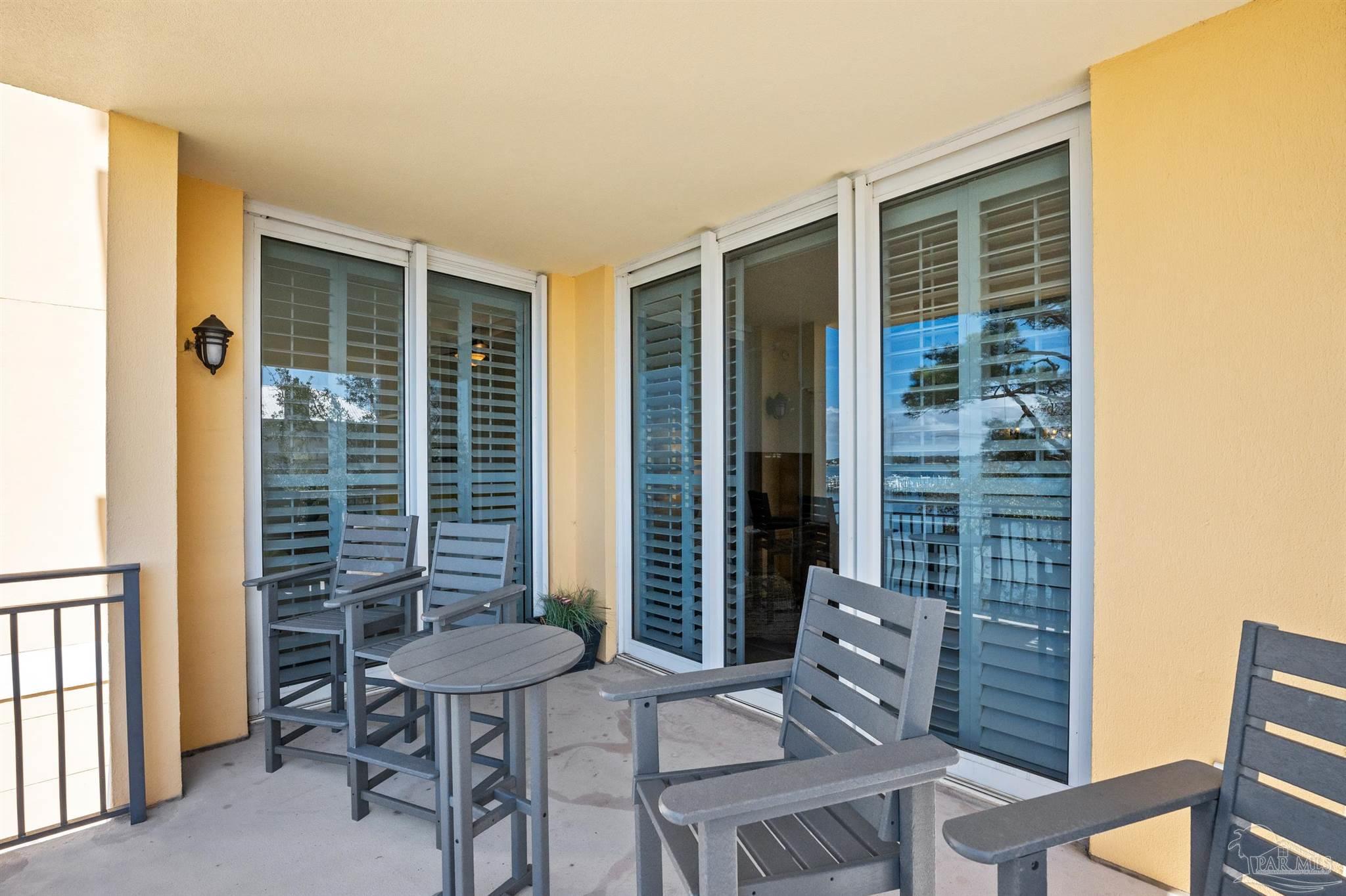 14500 River Road, Unit 101 Pensacola, FL 32507 - Photo 59 of 61 a view of a chair and table in the balcony