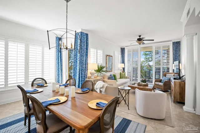a living room with furniture large window and flat screen tv
