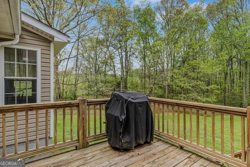 80 Upper Caldwell Road Bowdon, GA 30108 - Photo 23 of 33 a view of balcony with wooden floor and outdoor seating