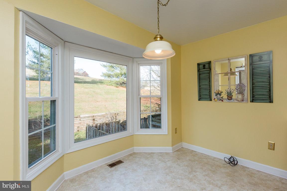 5592 Rivendell Place Frederick, MD 21703 - Photo 15 of 28 Plenty of table space in the sunny kitchen