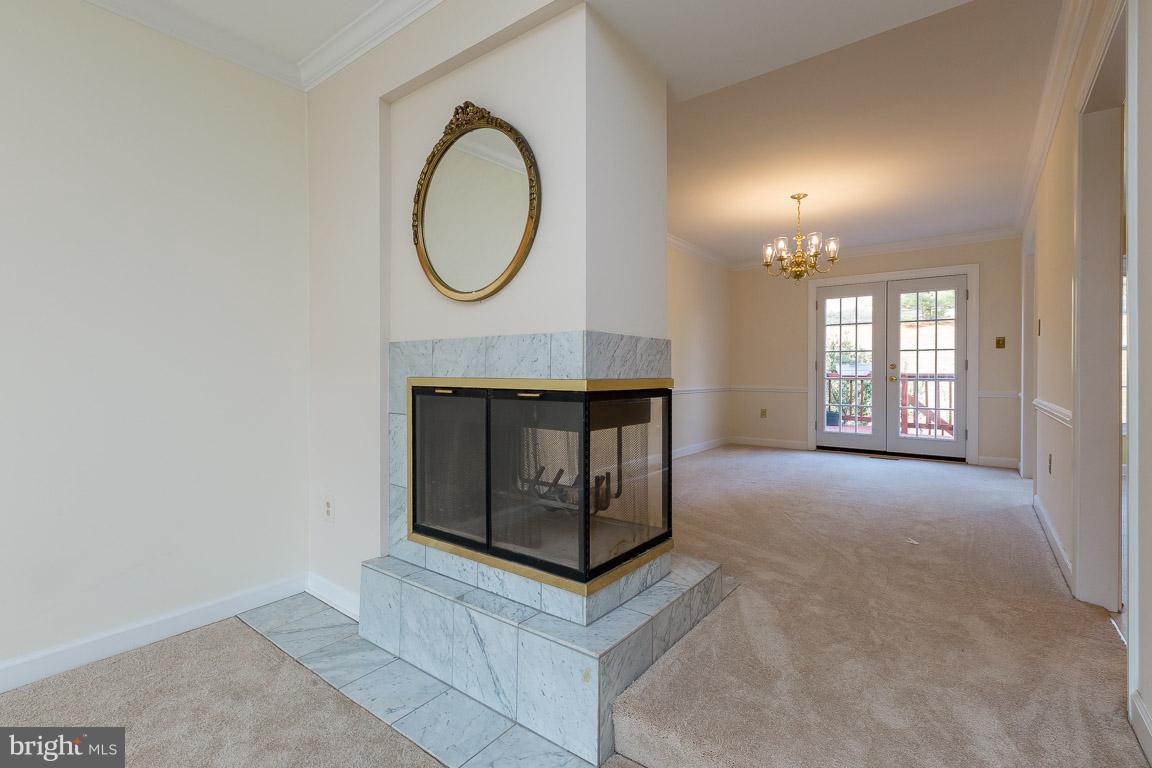 5592 Rivendell Place Frederick, MD 21703 - Photo 6 of 28 Fireplace opens to spacious Dining Room