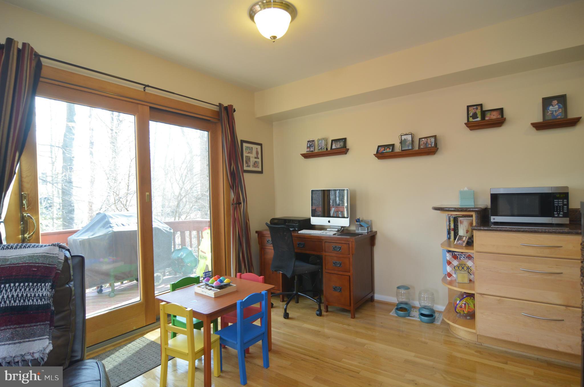 2041 Swans Neck Way Reston, VA 20191 - Photo 14 of 30 Living Room w/ Sliding Glass Doors to Upper Deck