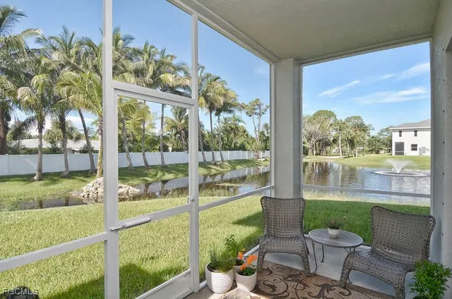 a view of a porch with chairs and table in patio