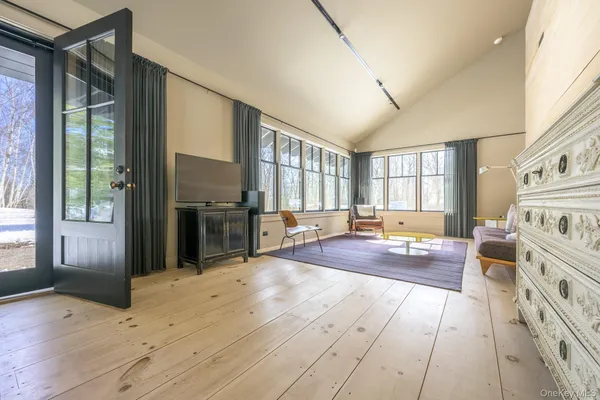 a kitchen with sink cabinets and living room