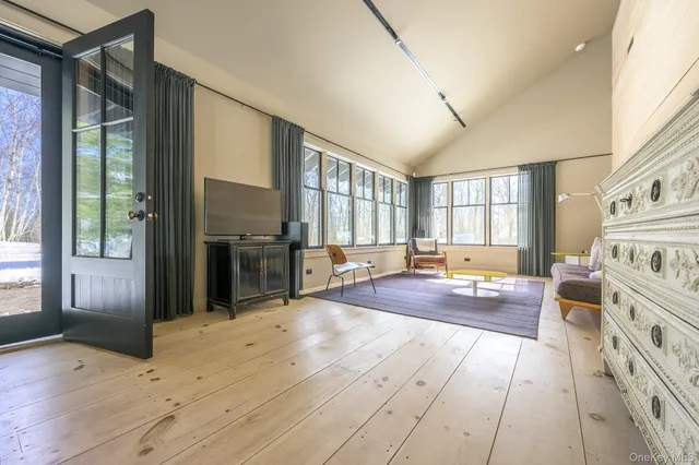 a kitchen with sink cabinets and living room