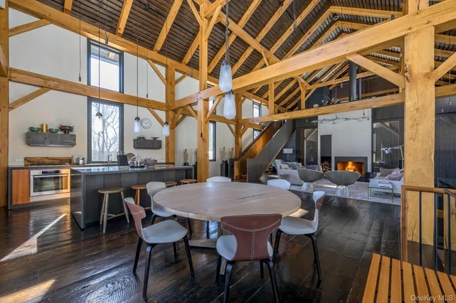 a view of a dining room with furniture wooden floor and a rug