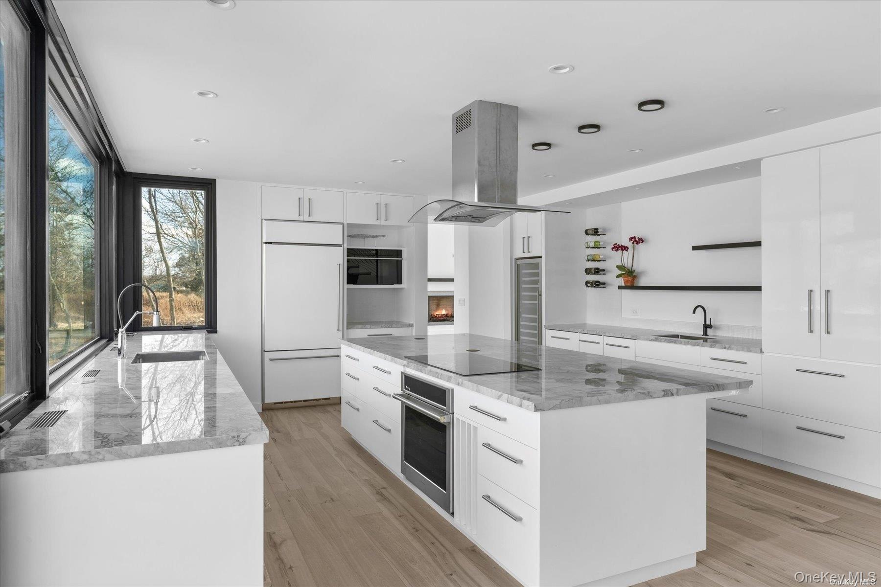 290 Windward Road Orient, NY 11957 - Photo 17 of 31 a kitchen with stainless steel appliances granite countertop a sink a stove and a refrigerator