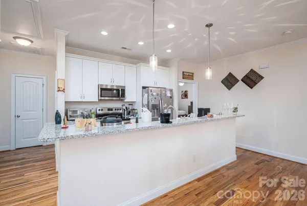 a kitchen with sink and refrigerator