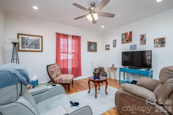 a living room with furniture and a flat screen tv