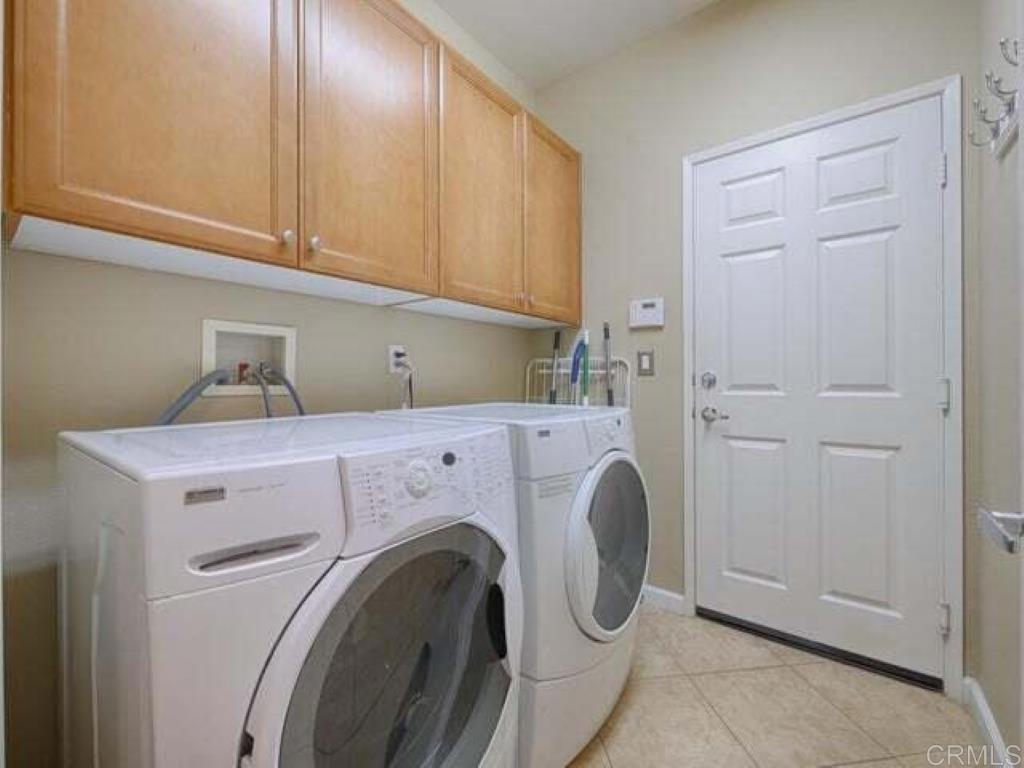80596 Key Largo Avenue Indio, CA 92201 - Photo 25 of 59 a utility room with dryer and washer