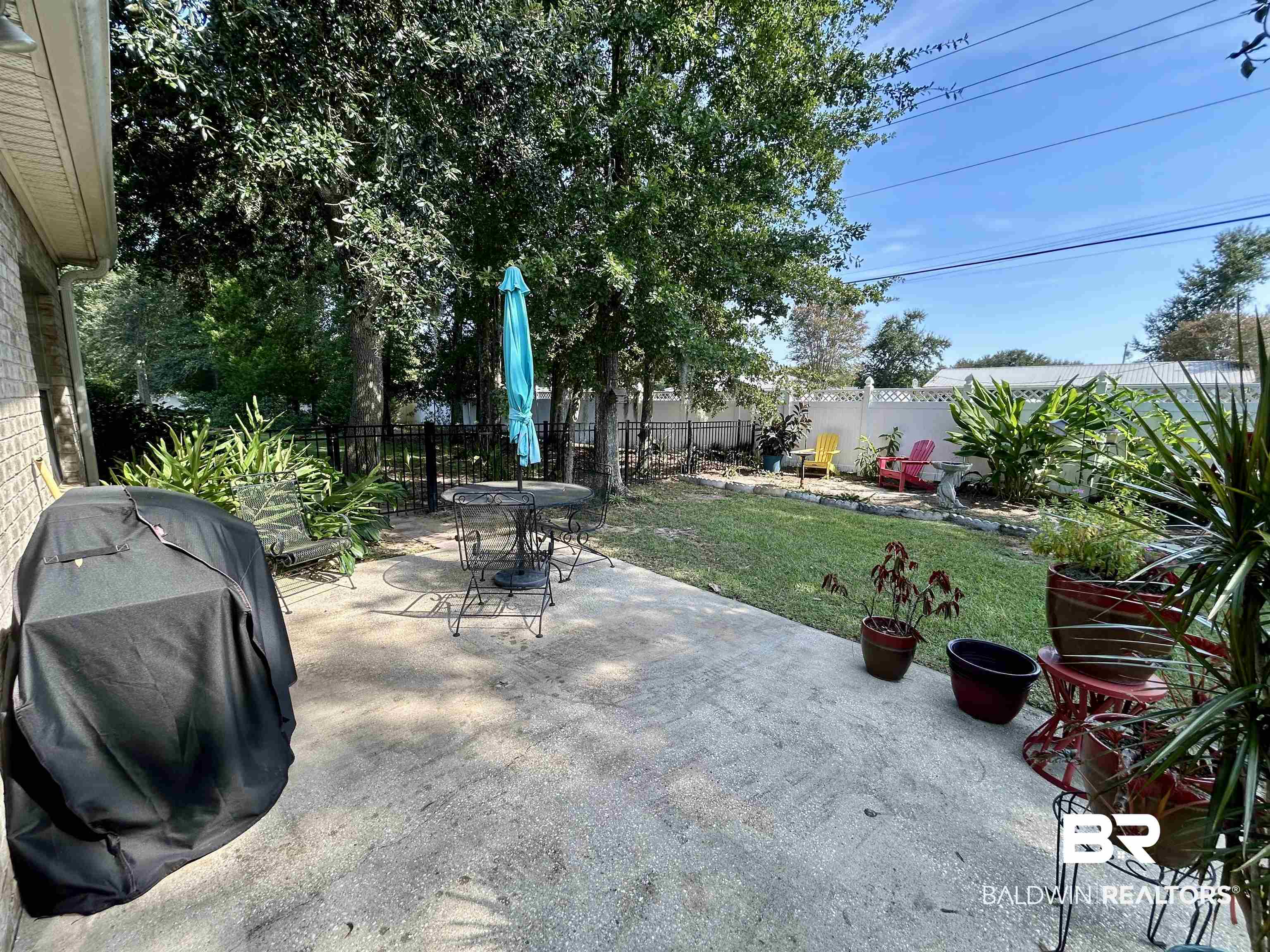 177 Mark Twain Loop Foley, AL 36535 - Photo 31 of 47 Fenced backyard with a patio area and area for grilling