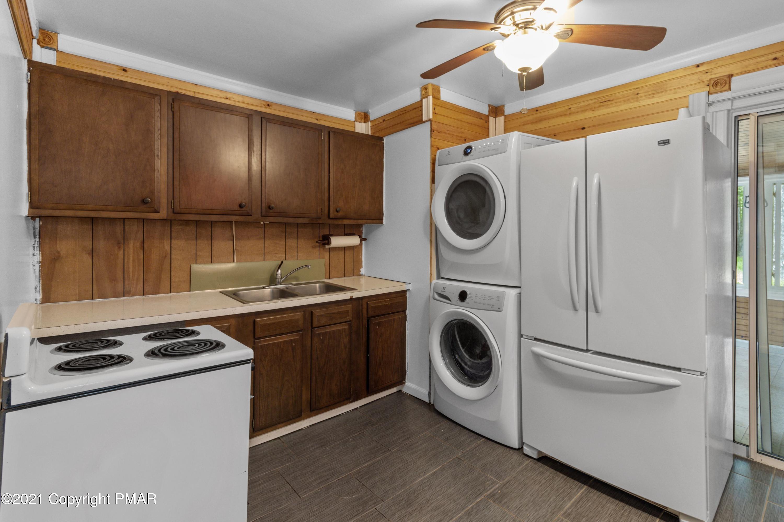 301 Old Ford Road White Haven, PA 18661 - Photo 5 of 22 a kitchen with a stove a sink and a refrigerator