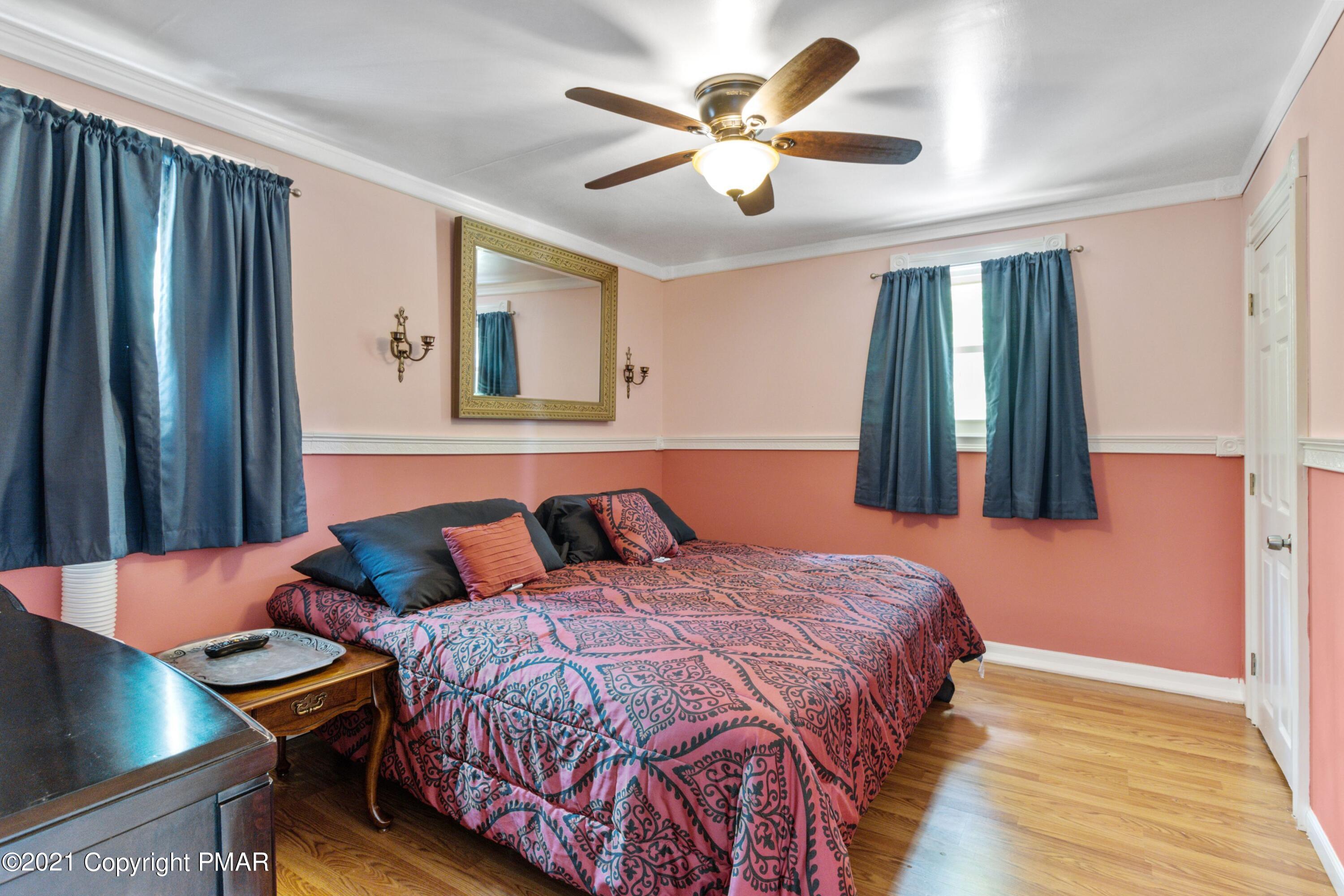 301 Old Ford Road White Haven, PA 18661 - Photo 9 of 22 a bedroom with a bed and a chandelier