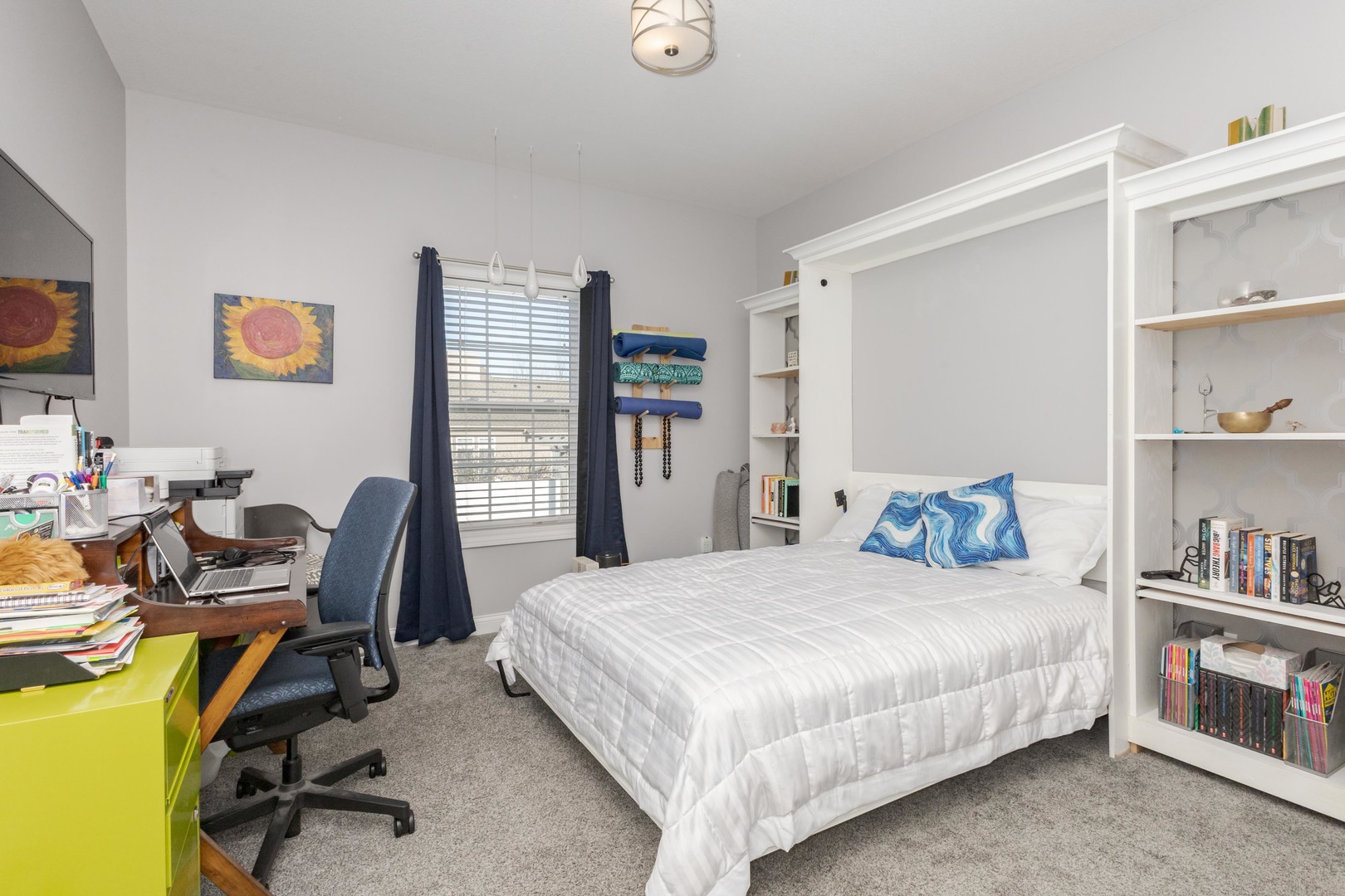 2603 Piney Run Bloomington, IL 61705 - Photo 22 of 42 a bedroom with a bed a computer on a desk and a book shelf