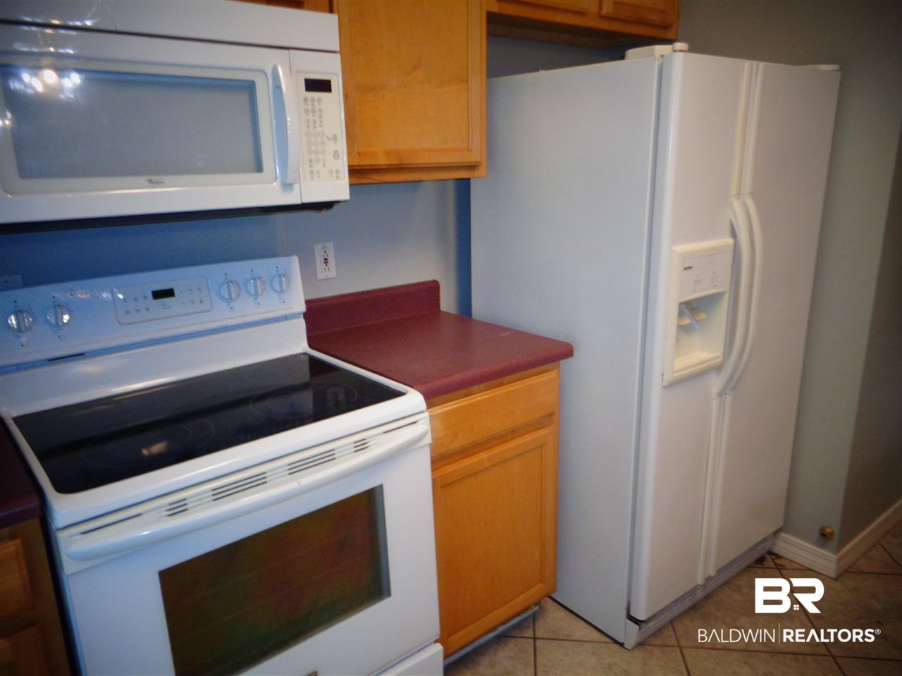 27020 Lake Road Orange Beach, AL 36561 - Photo 5 of 30 Kitchen-- electric stove, microwave, refrigerator