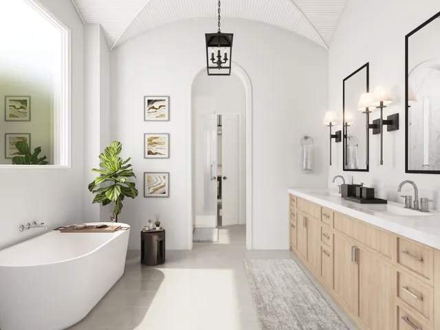 a spacious bathroom with a tub sink and mirror