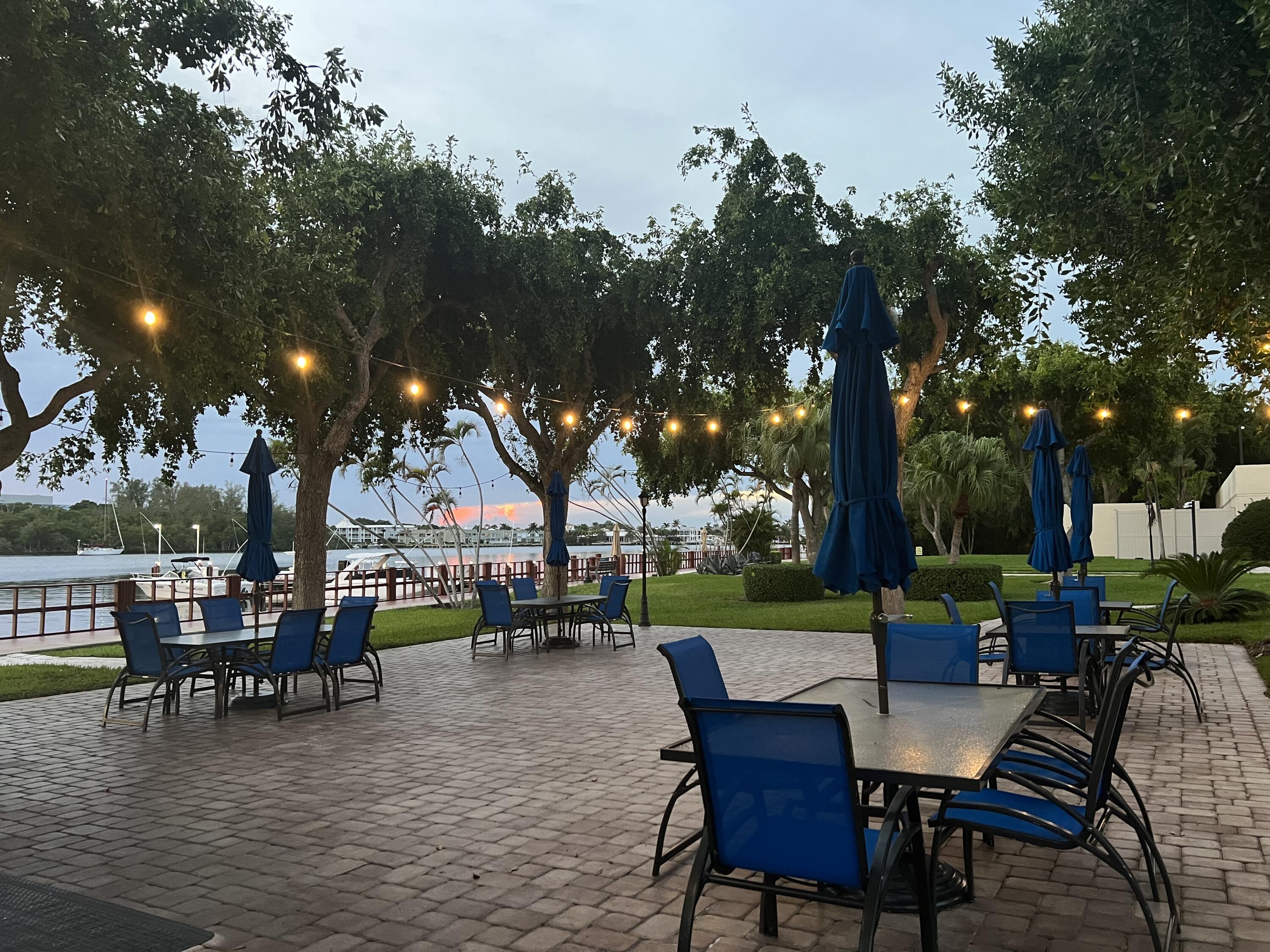 2121 North Ocean Boulevard, Unit 609W Boca Raton, FL 33431 - Photo 23 of 27 a view of a house with a chairs and table in a patio
