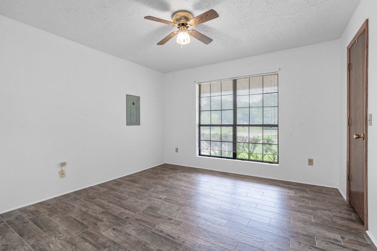 13180 Morgan Drive Splendora, TX 77372 - Photo 18 of 38 Bedroom number #2 located at the front of the home. Beautiful new flooring and a nice sized closet area.